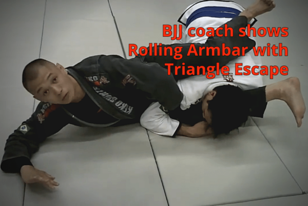 10-bjj_coach_shows_rolling_armbar_with_triangle_escape