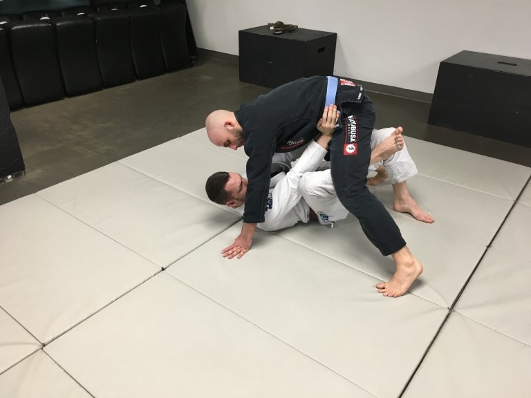 Bridge Escape into Butterfly Guard from bottom Mount in BJJ