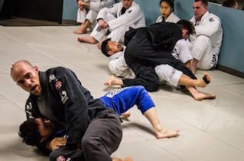 Students rolling in our BJJ group class in Vancouver
