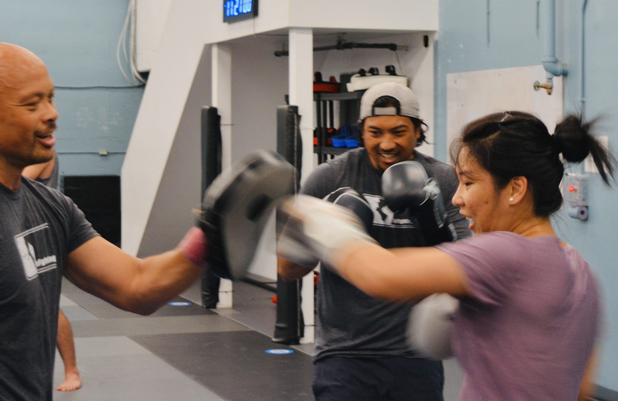 an instructor teaching a kickboxing class