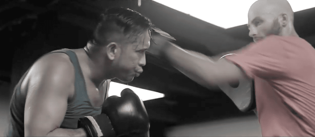 A personal trainer teaching Kickboxing to a client at our Vancouver gym